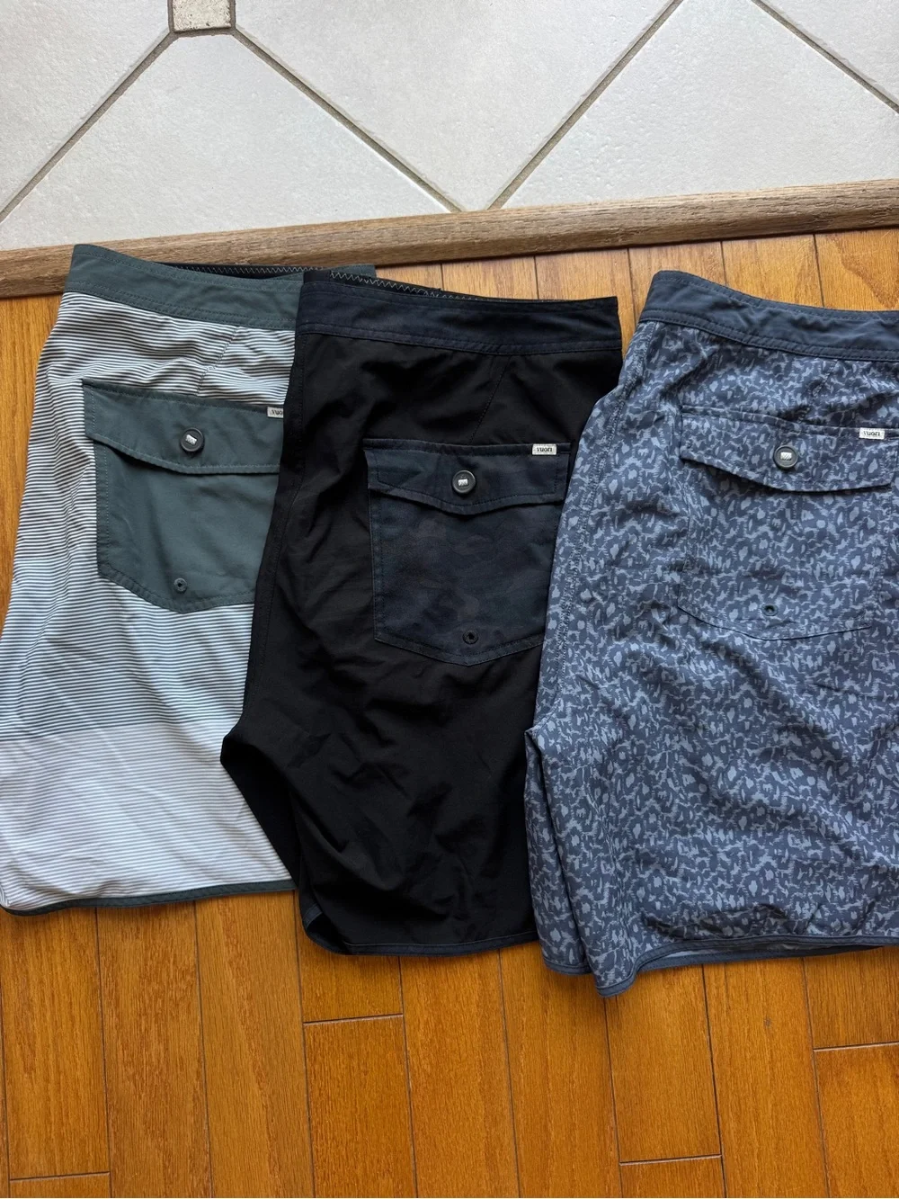 Vuori Men's Swim Trunks Trio — Black, Blue Pattern & Gray-Green Pocket